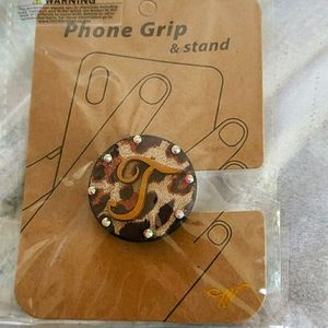 Initial T grip and phone stand